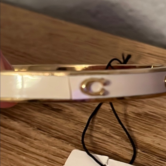 Coach Gold and White Bracelet. Has small crack in white paint on one side. - Picture 4 of 6